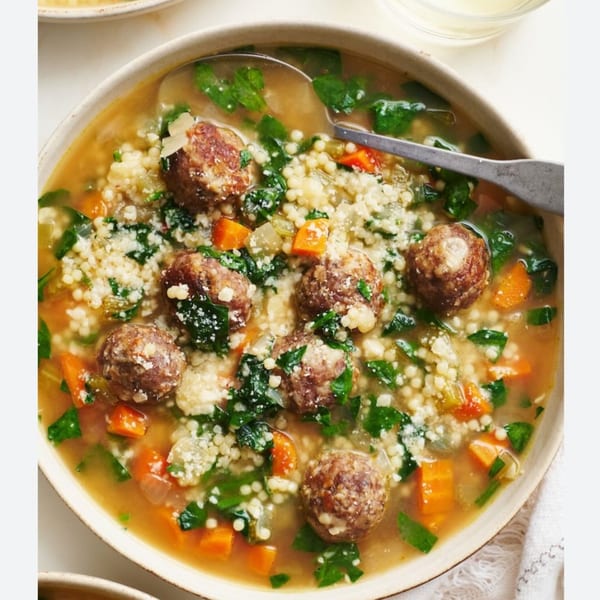 Monjunis Italian Cafe & Grocery's Italian wedding soup with meatballs, pasta, carrots, and spinach.